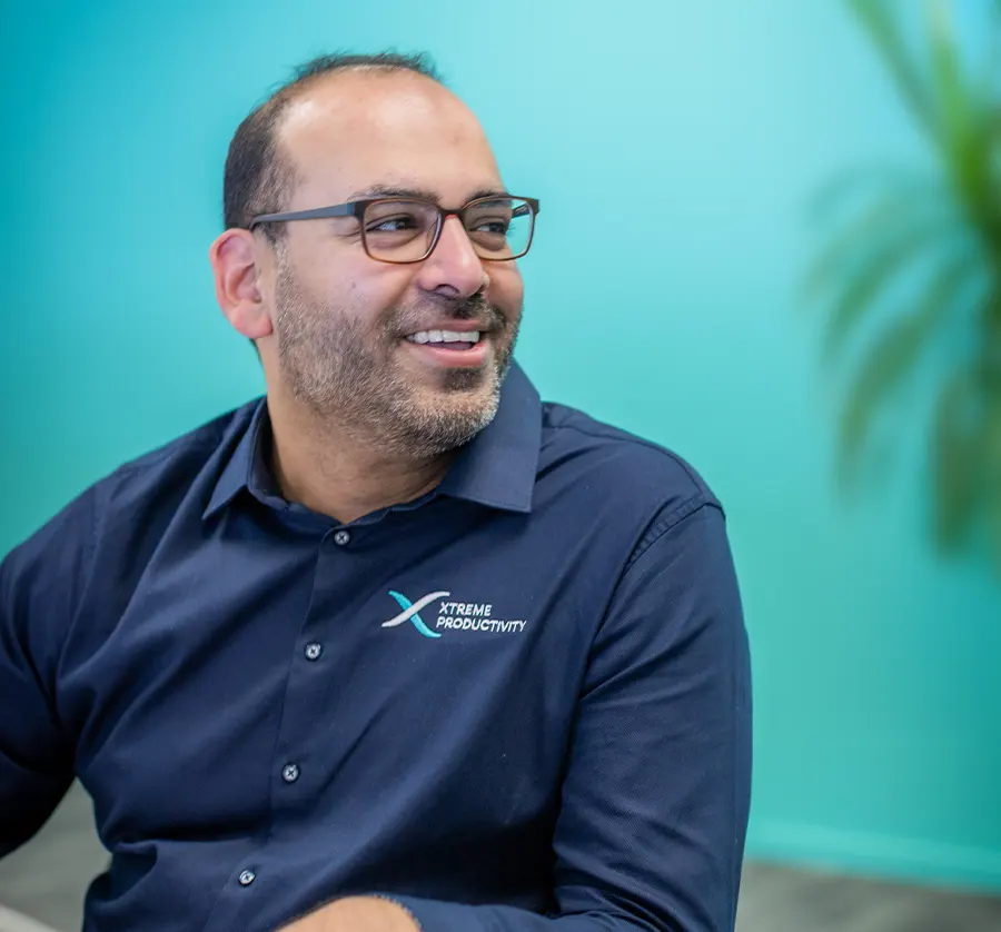 smiling XP staff member offering bookkeeping for nonprofits